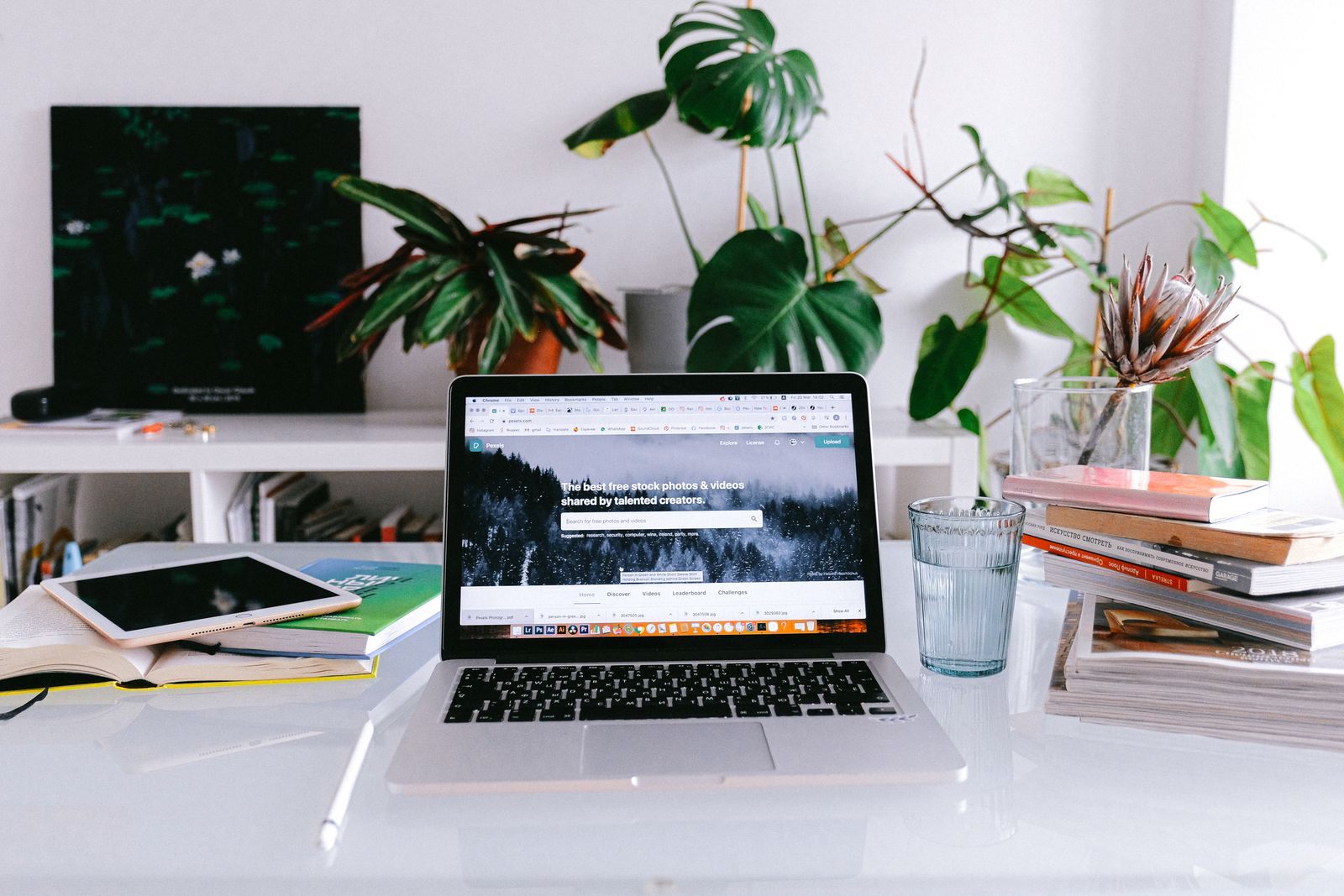Bright home office desk with a laptop and books for reading offer terms